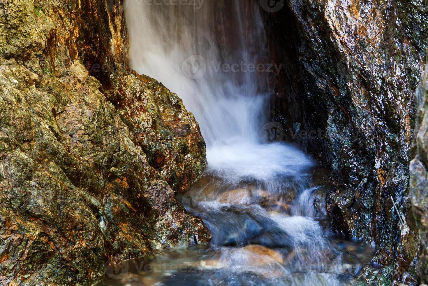 Long Exposure Small Waterfall And Creek With Rocks photo