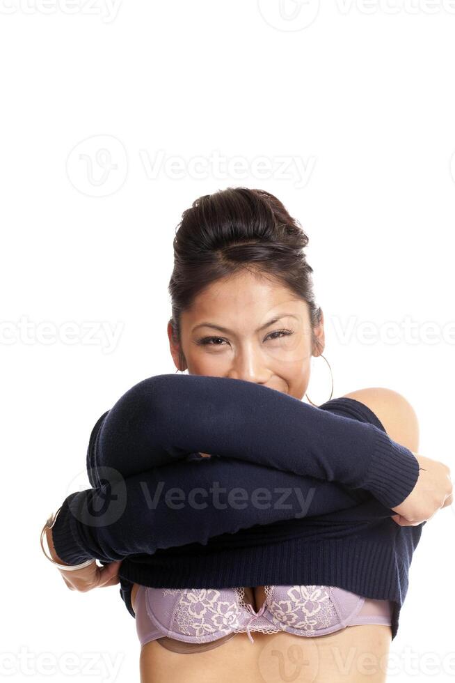 Young Pacific Island Woman Removing Sweater showing bra photo