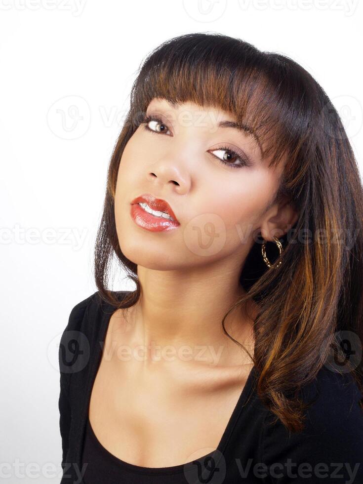 Young black woman portrait head tilted back photo
