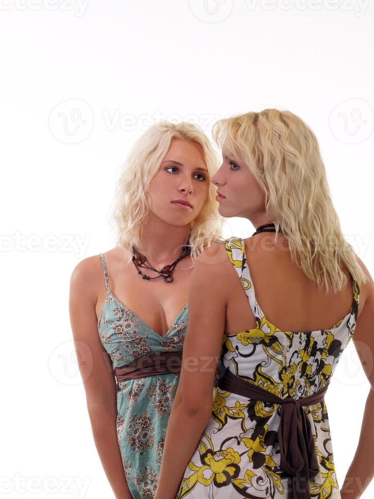 Two blond sisters in summer dresses photo