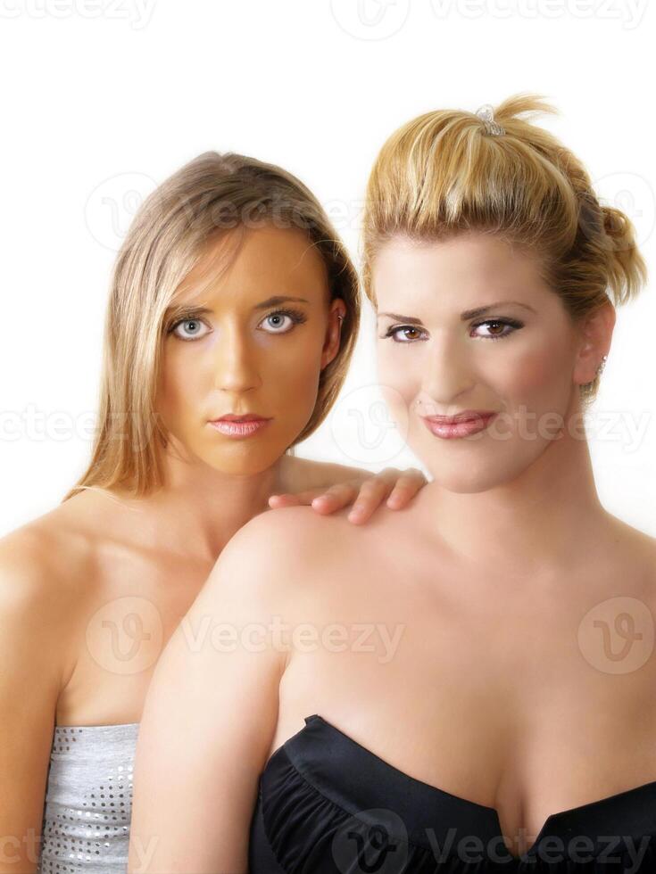 Two blond women bare shoulder portrait white photo