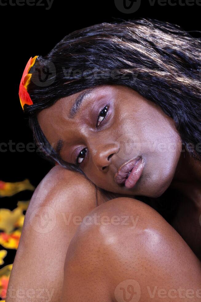 African American Woman Head On Knees Leaves photo