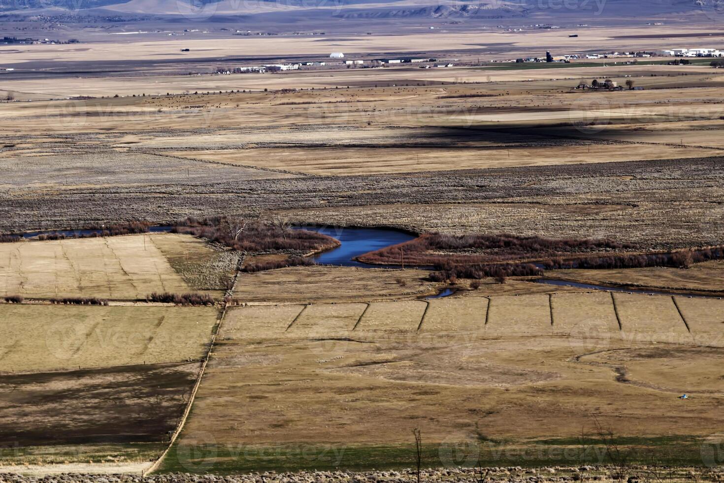 Valley Flatlands From Foothills With Waterway And Scattered Buildings photo