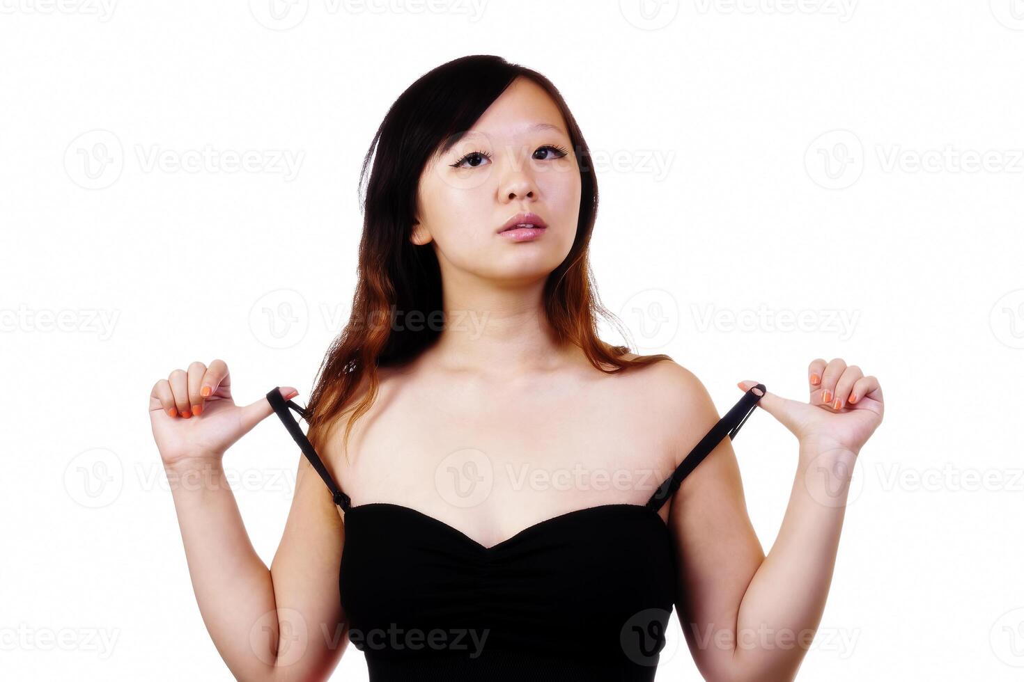 Asian American Woman Pulling On Dress Straps photo