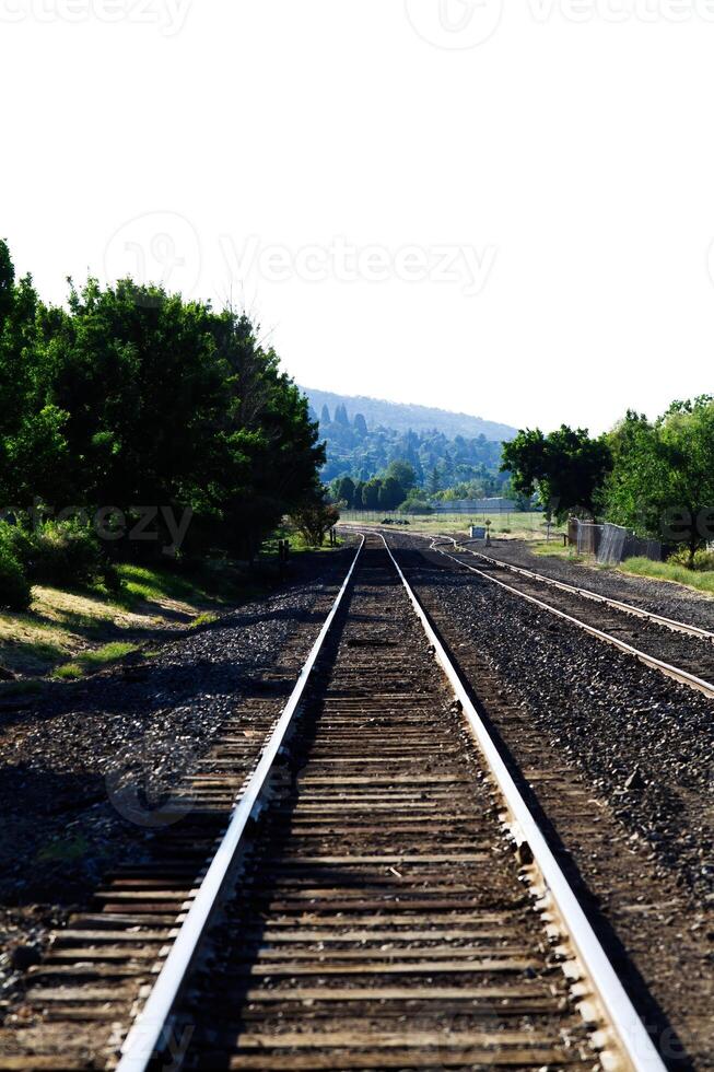 Empty Railroad Tracks Leading To Turn photo