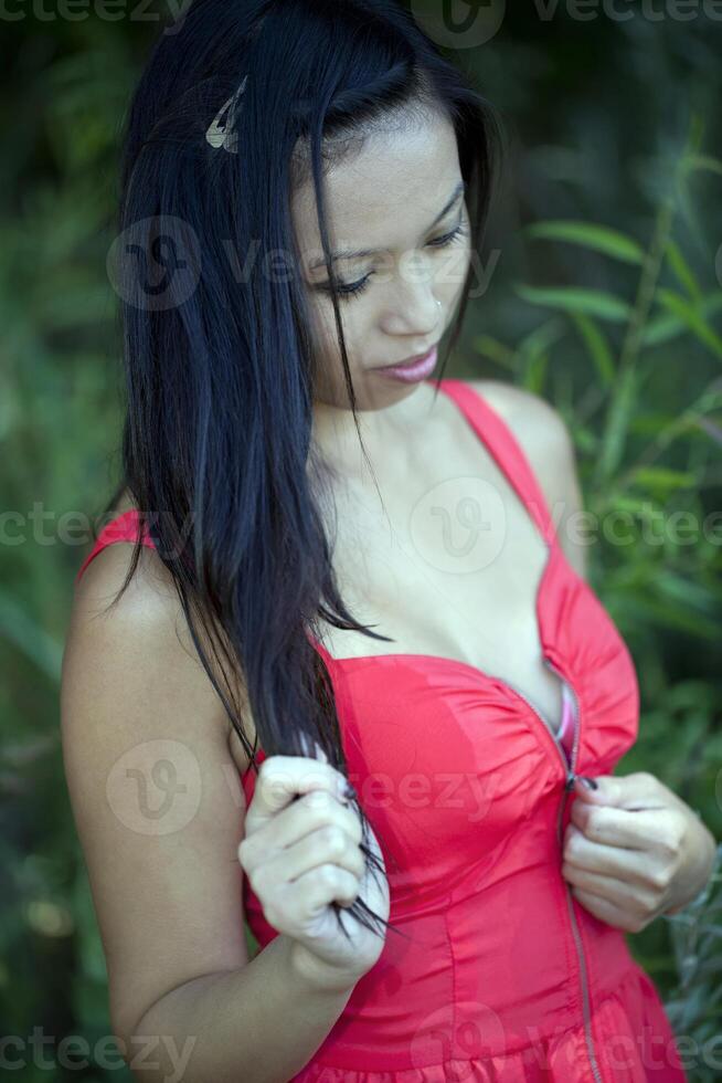 Young Asian American Woman Red Dress Outdoors photo