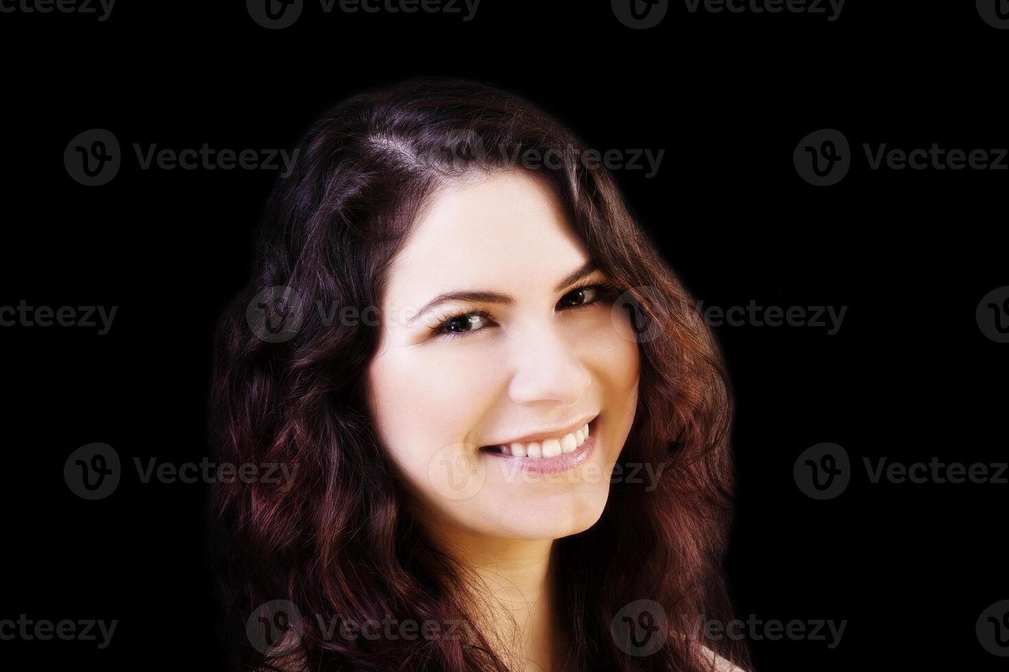 Smiling Portrait Young Caucasian Woman On Dark Background photo