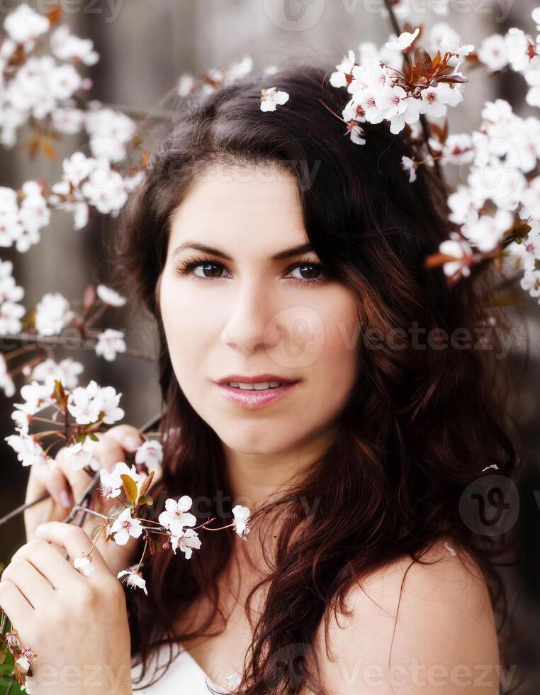 Caucasian Woman Portrait Among White Blossoms Outdoors photo