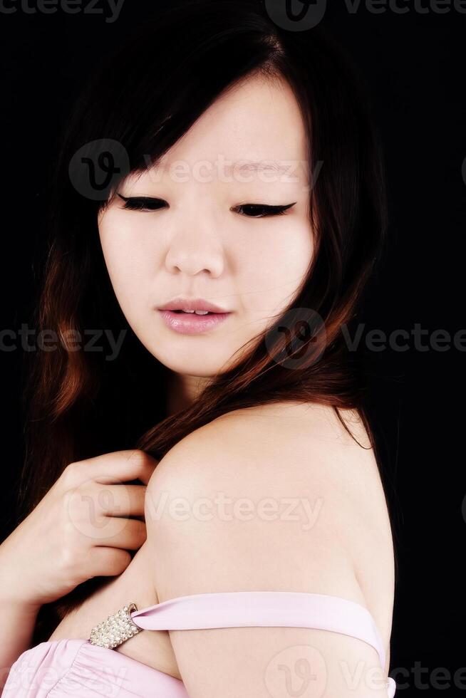 Portrait Chinese American Woman Eyes Closed Black Background photo