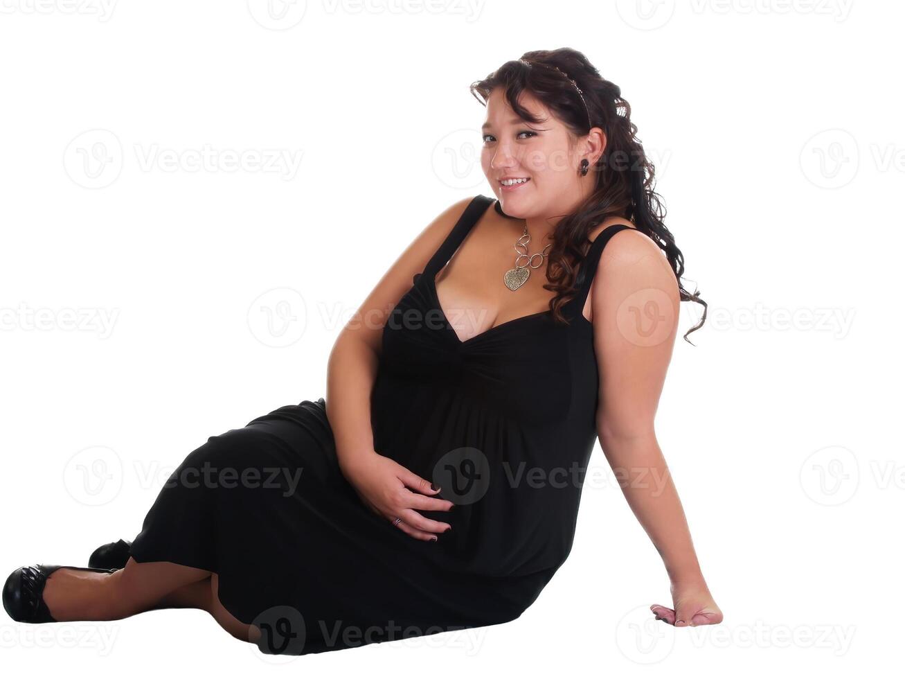 Caucasian Pregnant Woman Sitting On White Background photo