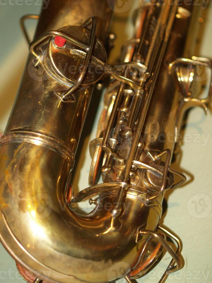 Closeup-up Detail Of Metal Key Pads On Old Saxophone photo