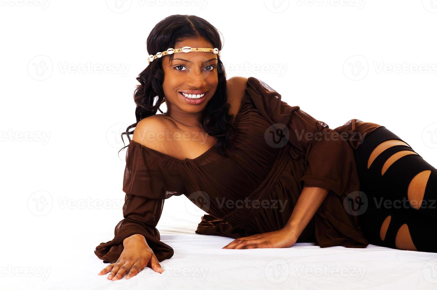 Reclining Young Woman In Brown Top And Black Leggings photo