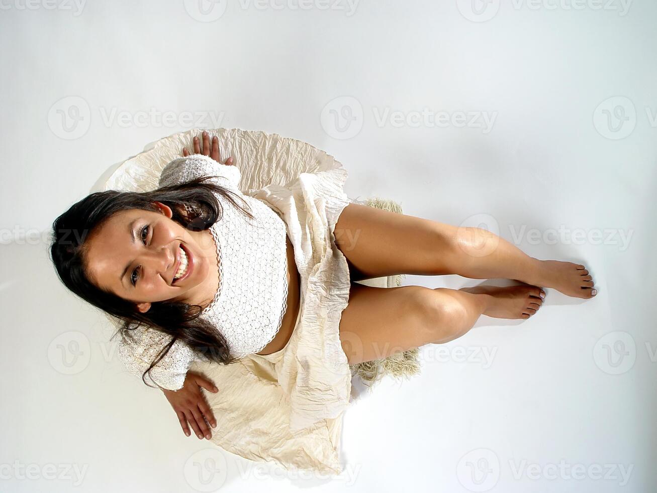 Caucasian Woman Smiling Looking Up From Seated Position photo