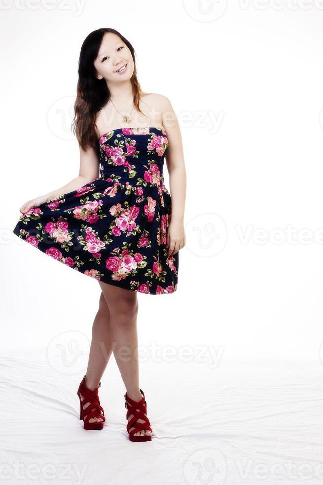 Attractive Smiling Chinese American Woman Standing In Dress photo