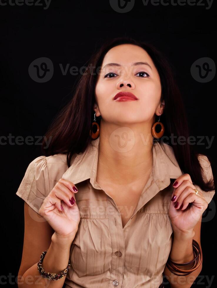 Attractive Filipina Woman In Brown Top Holding Collar photo