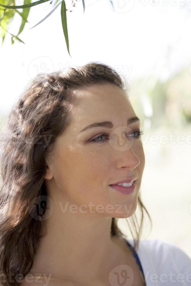Outdoor portrait attractive brunette caucasian woman photo