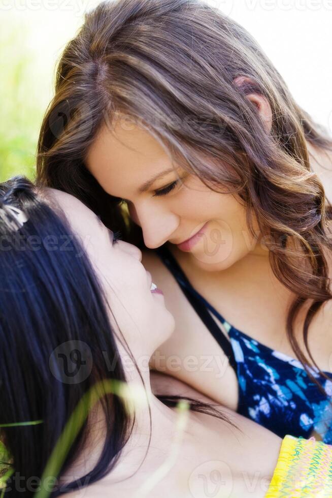 Caucasian And Asian American Close Outdoor Portrait photo