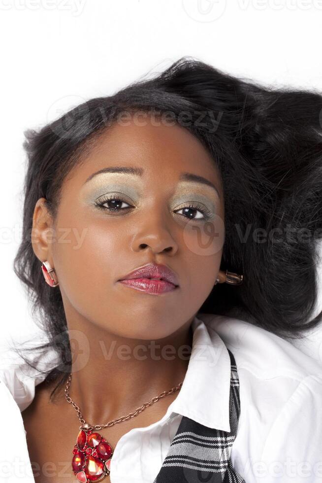 Portrait attractive young African American woman reclining photo