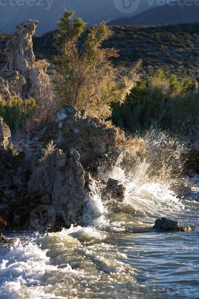 Wave Breaking On Tufa Limestone Formation Mono Lake California photo