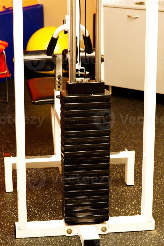 Weight Machine Sitting In Small Exercise Room photo