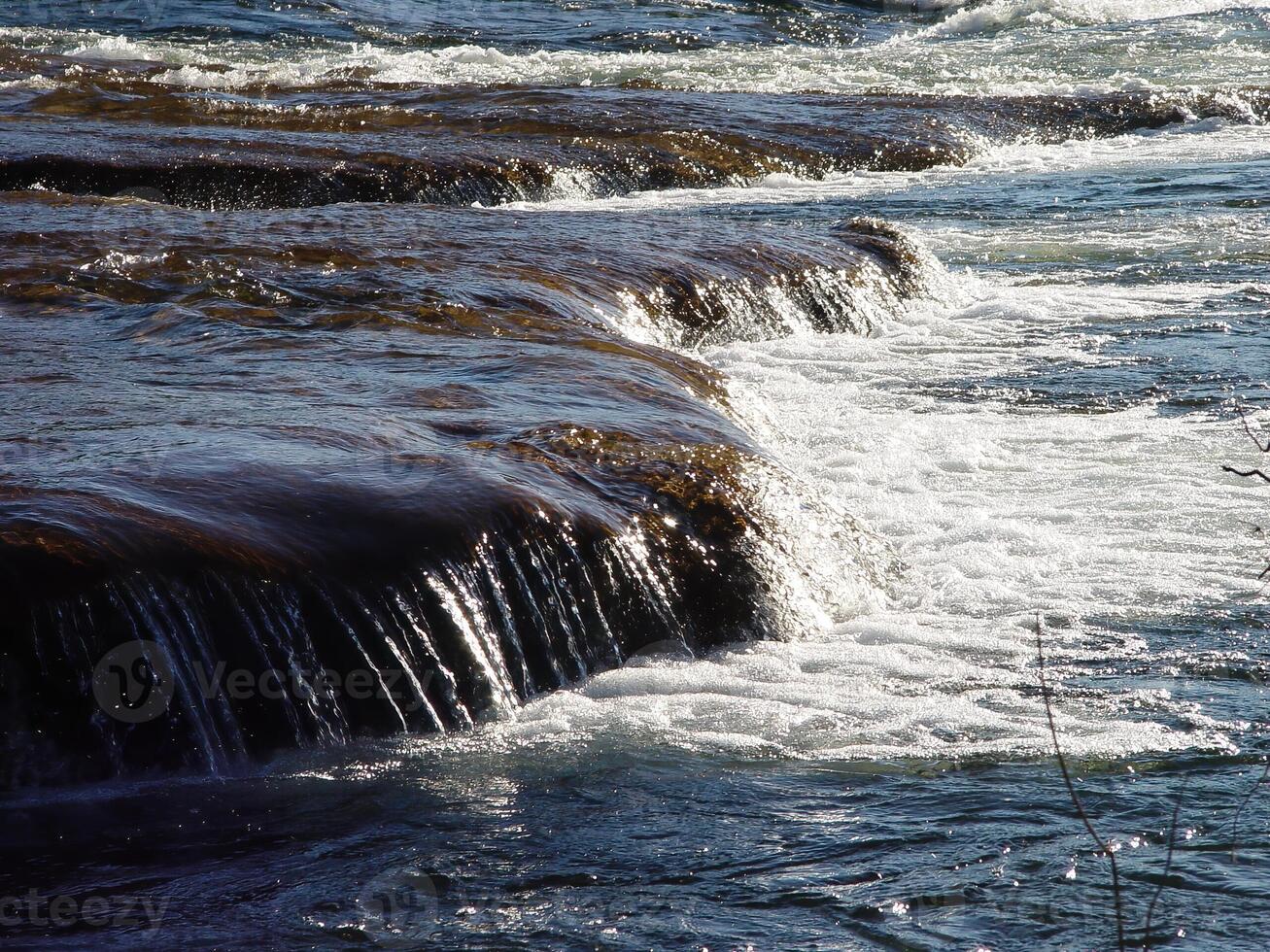 River Water Pouring Over Small Drop White Water Rapids photo