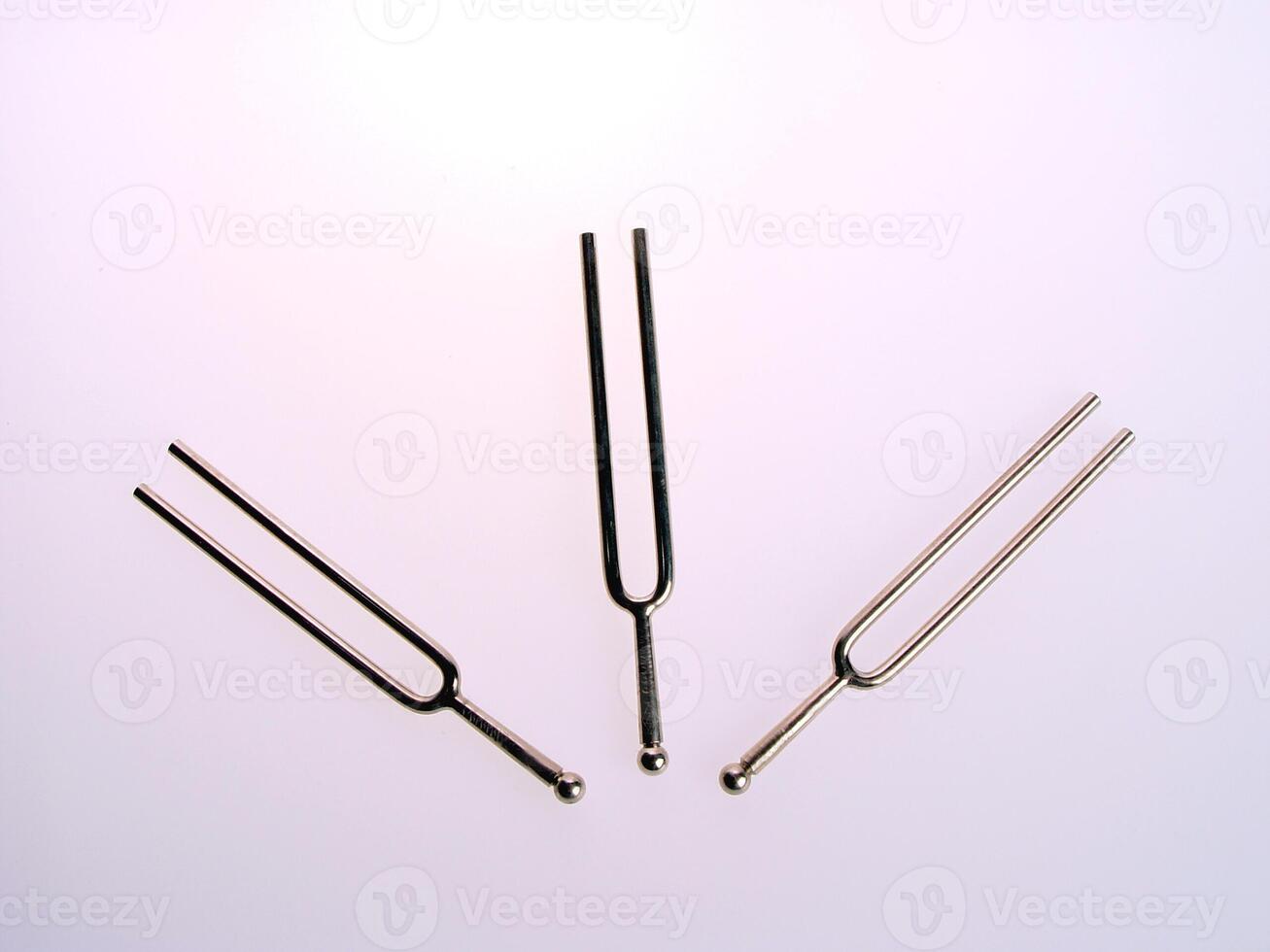 Three Tuning Forks On Surface photo