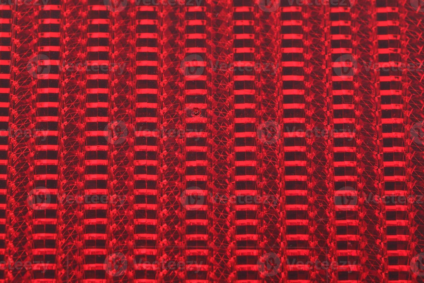 closeup of red bicycle reflector columns and rows photo
