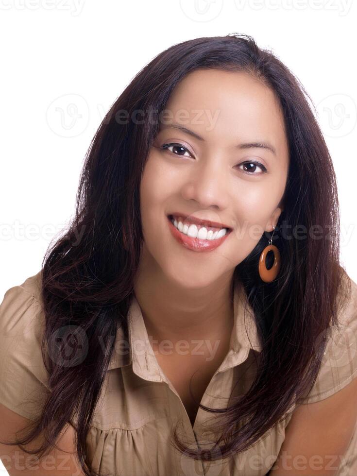 Smiling young hispanic woman portrait in brown top photo