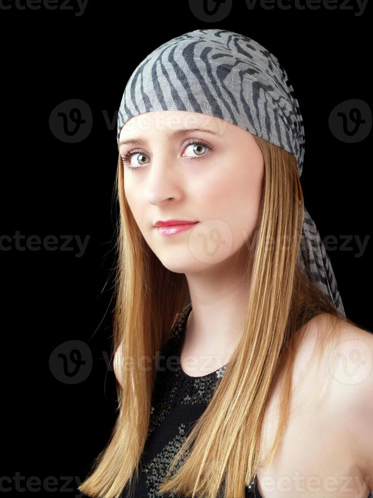 Young caucasian woma in head scarf with green eyes photo