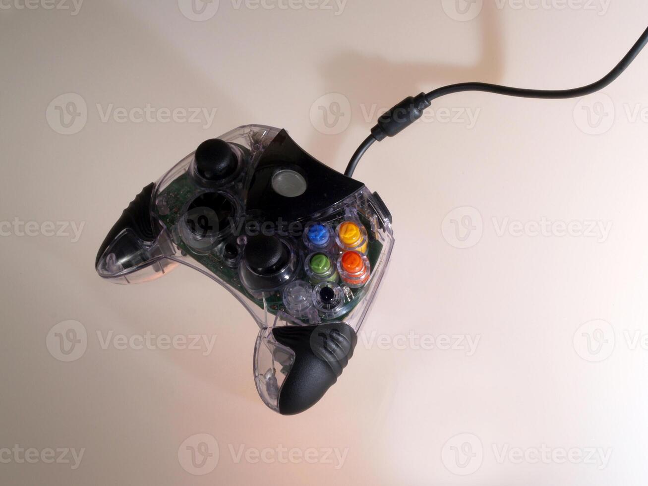 Game Controller With Cord And Shadows photo