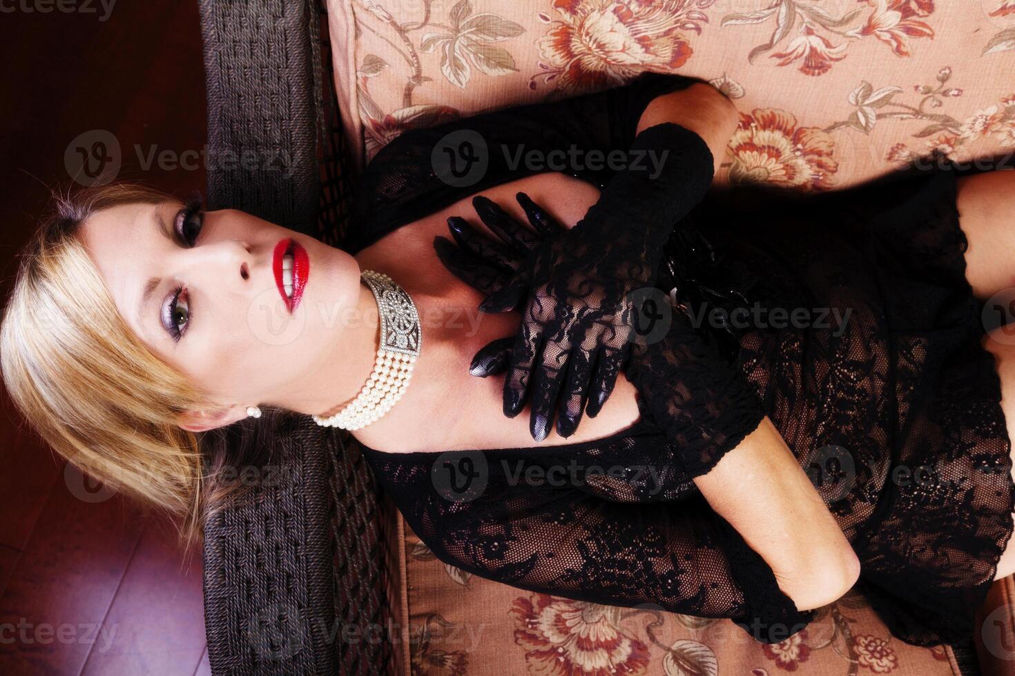 Reclining Blond Caucasian Woman Black Lace Dress photo