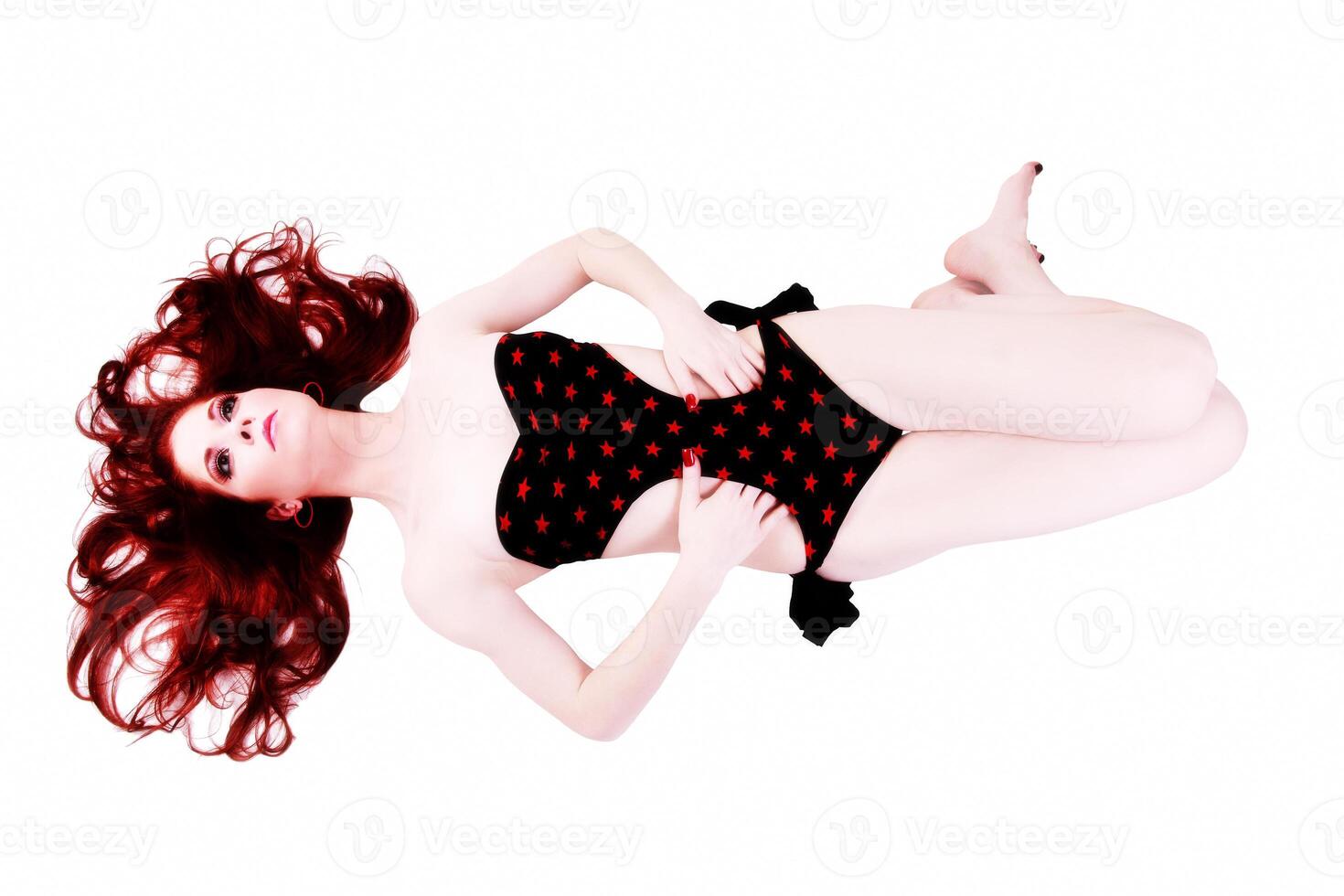 Red Head Woman Reclining Black One Piece Swim Suit photo