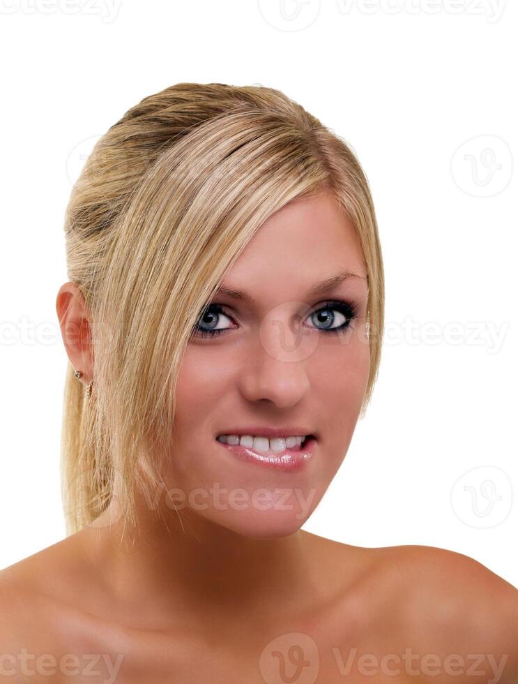 Young blond woman portrait biting lower lip photo