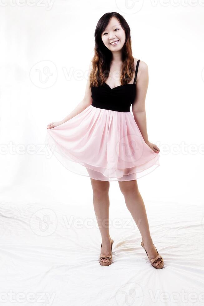 Chinese American Woman Standing In Pink And Black Dress photo