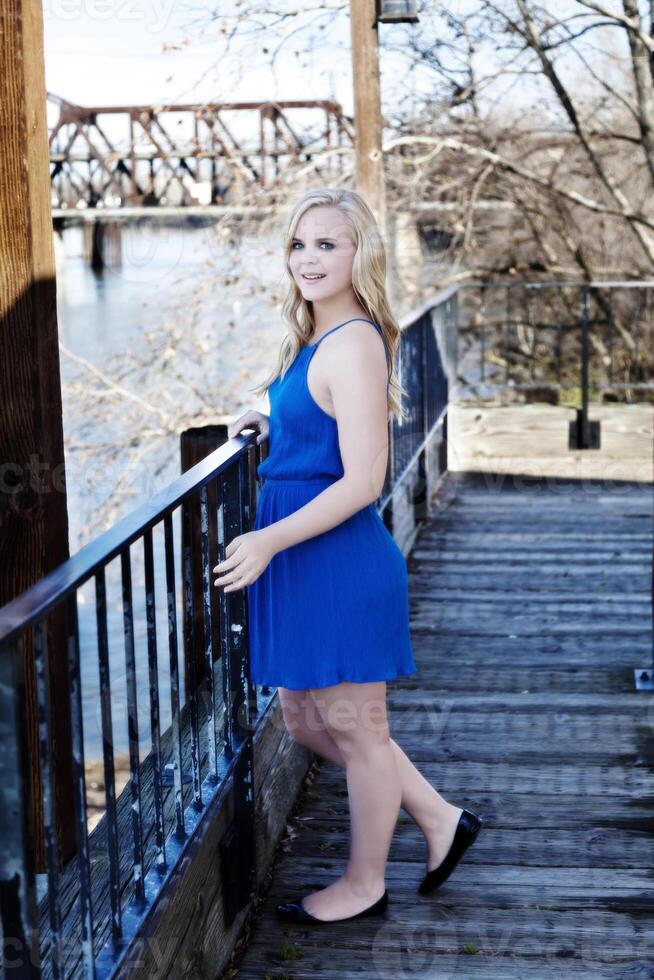 Blond Caucasian Woman Outdoor In Blue Dress photo