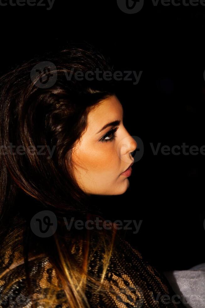 Profile Portrait Attractive Caucasian Woman On Dark Background photo