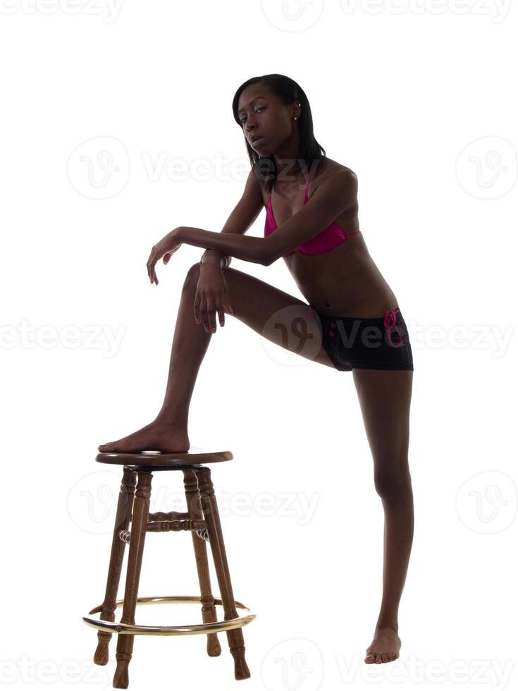 Young Black Woman with Foot on Stool photo