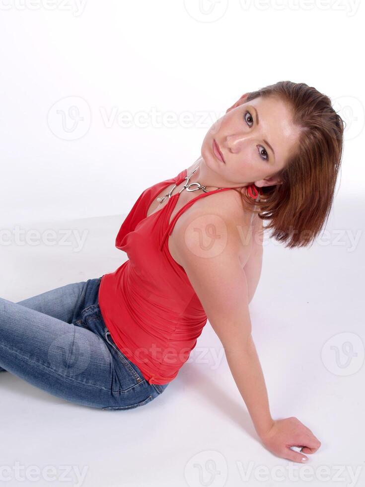 Red top and Jeans Caucasian Woman Sitting photo