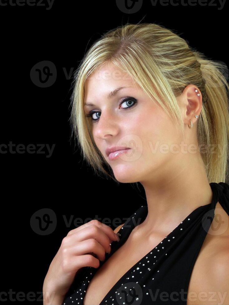 Young blond woman in elegant dress portrait photo