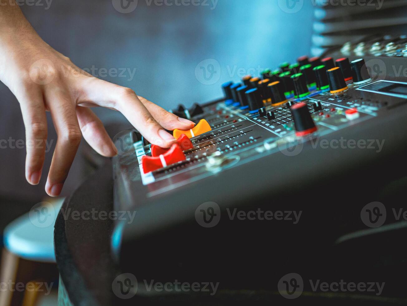 Sound engineer hands adjusting control sound mixer in recording, broadcasting studio,Sound mixer. Professional audio mixing console, buttons, faders and sliders. sound check. photo