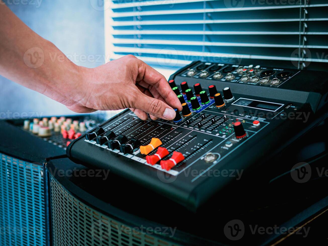 Sound engineer hands adjusting control sound mixer in recording, broadcasting studio,Sound mixer. Professional audio mixing console, buttons, faders and sliders. sound check. photo