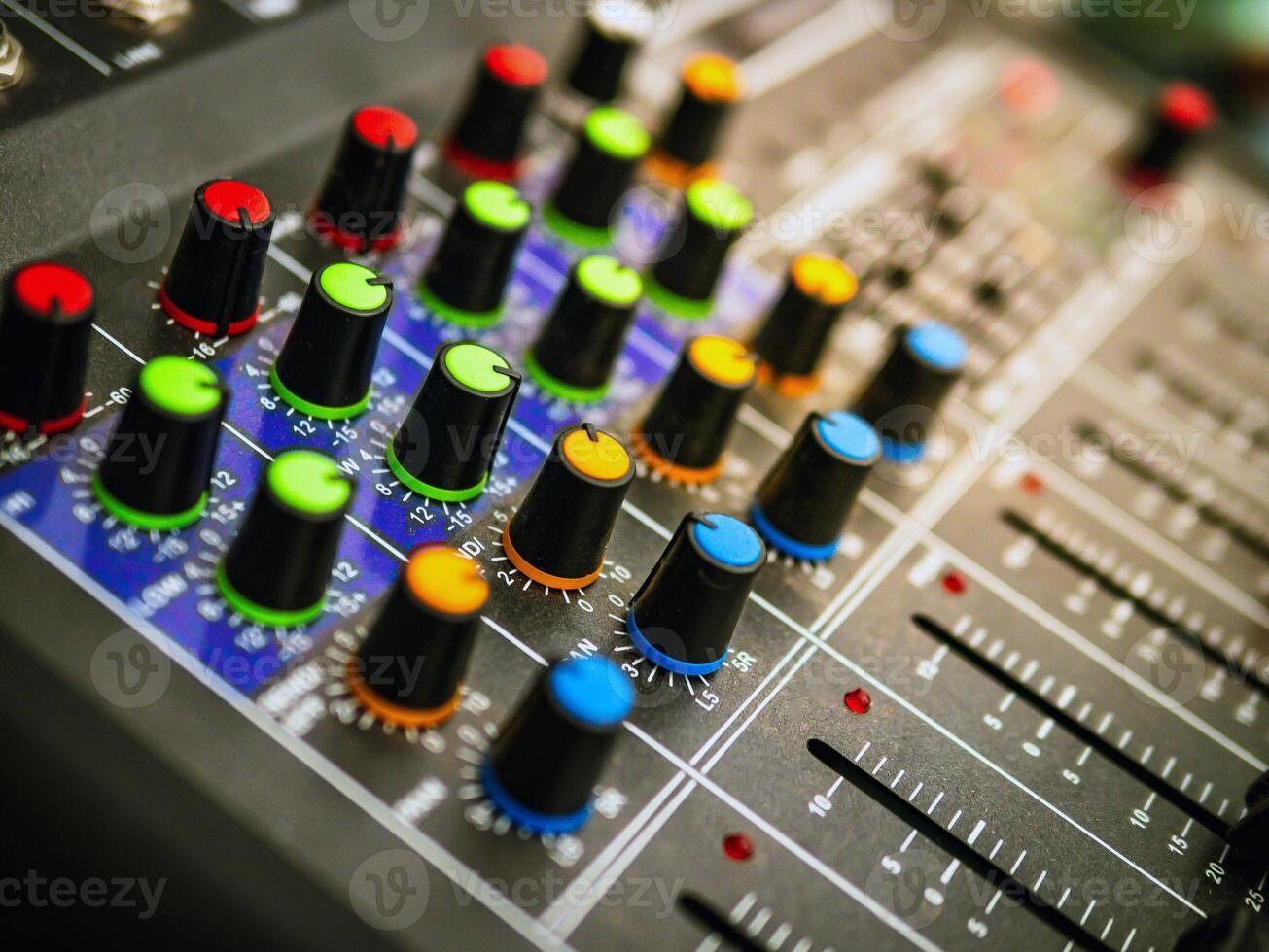 Close-up of sound recording equipment knobs.Mixer control. Music engineer. Backstage controls on an audio mixer, Sound mixer. Professional audio mixing console, buttons, faders and sliders. photo