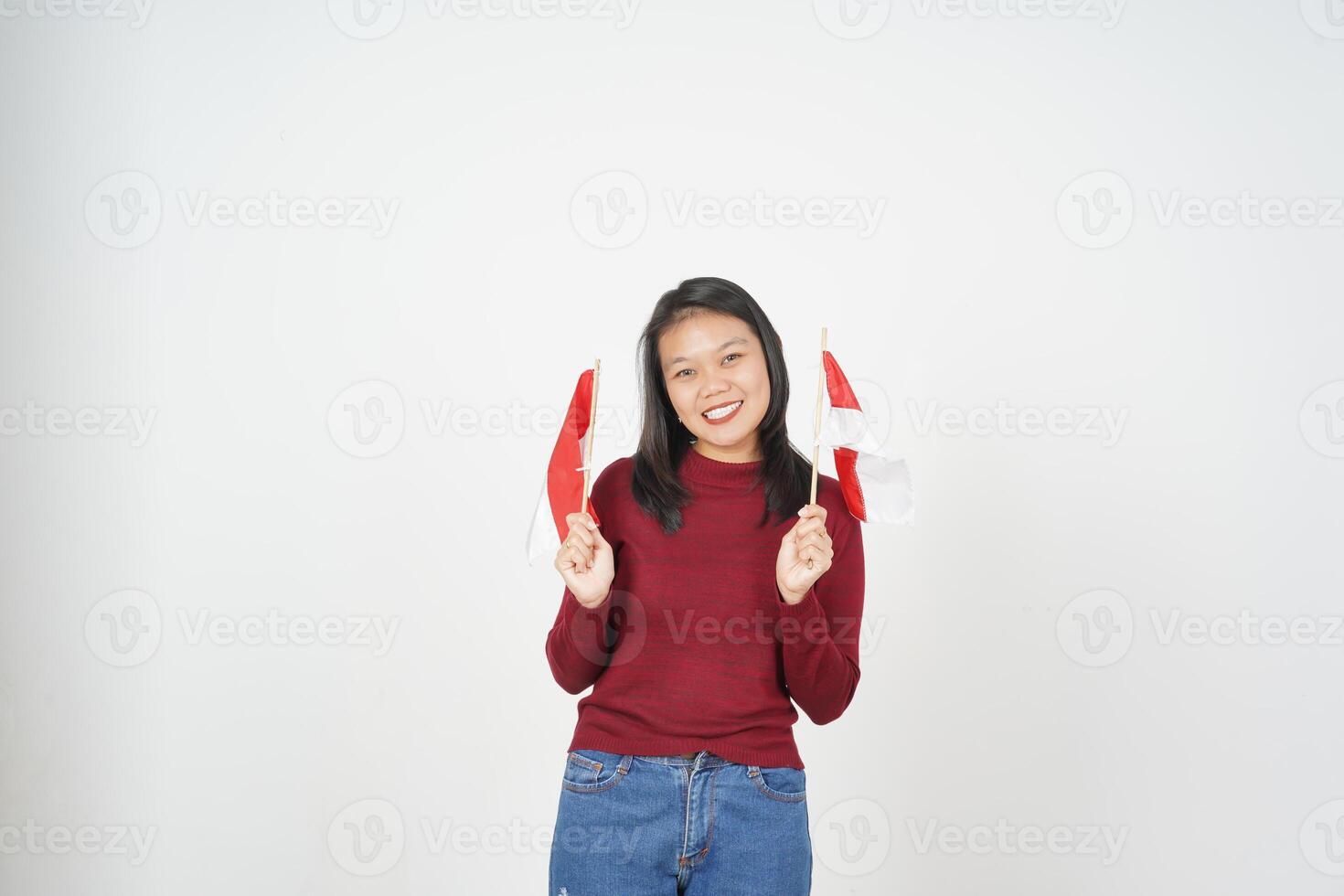 Young Asian woman in Red t-shirt Holding Indonesian flag, Independence day concept isolated on white background photo