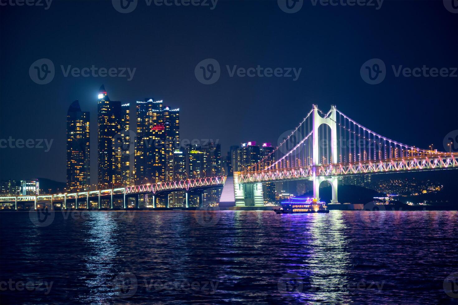 Gwangan Bridge and skyscrapers in the night. Busan, South Korea photo