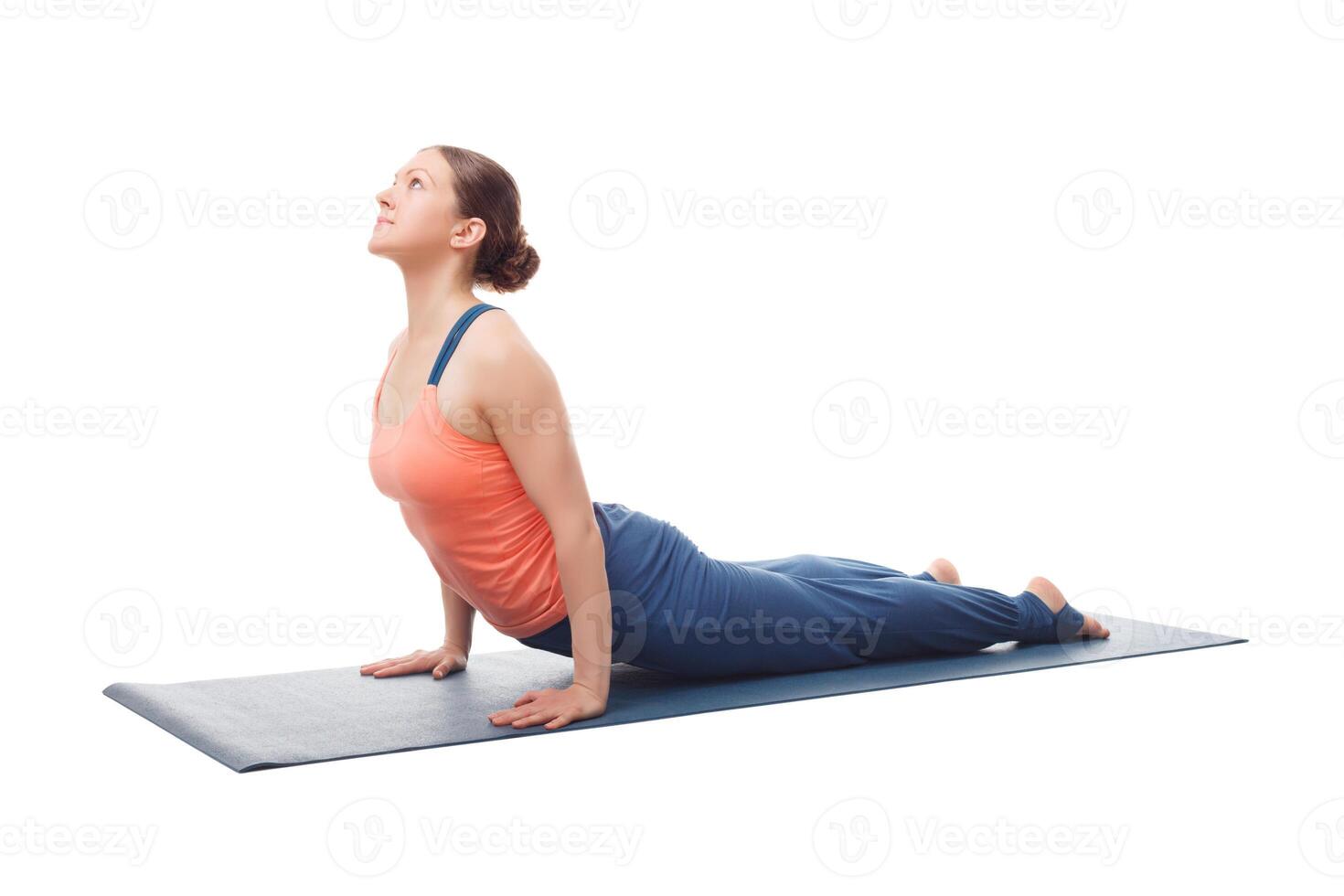 Sporty fit yogini woman practices yoga asana Urdhva mukha svanas photo