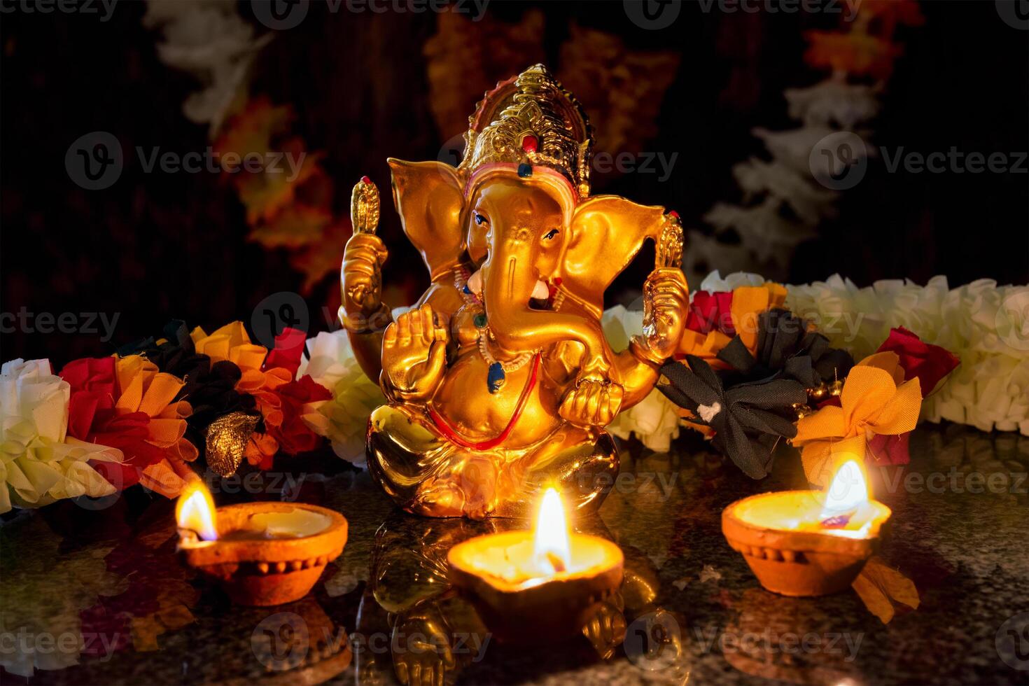 Ganesha with Diwali lights photo