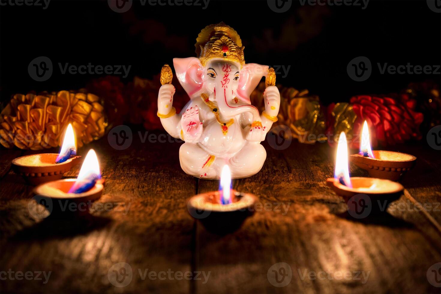 Ganesha with Diwali lights photo