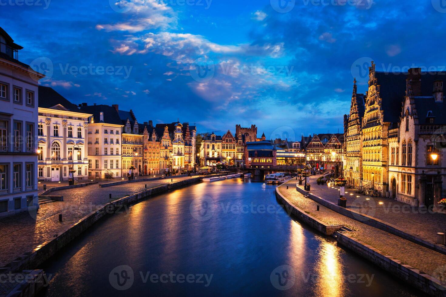 Graslei street and canal in the evening. Ghent, Belgium photo