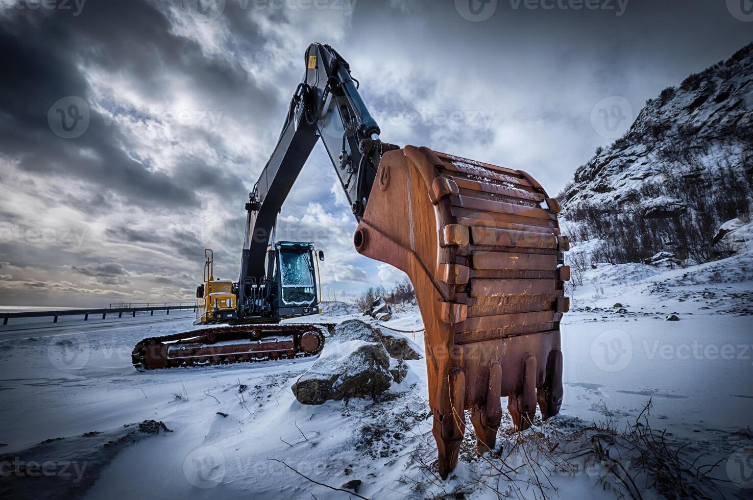 Old excavator in winter photo