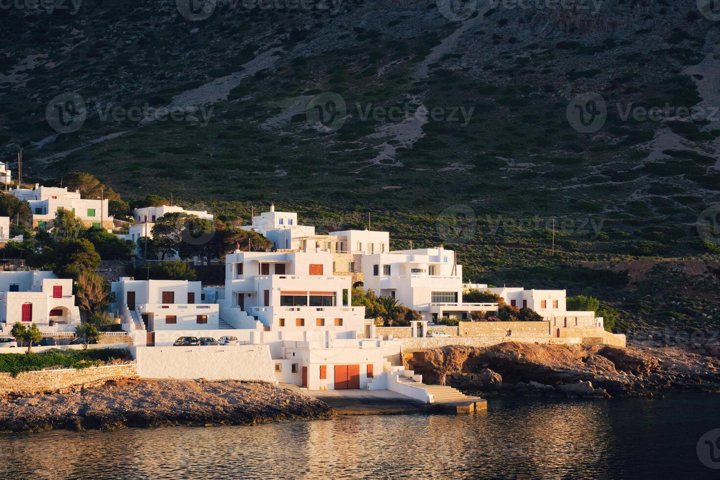 Kamares town with traditional white houses on Sifnos island on sunset. Greece photo